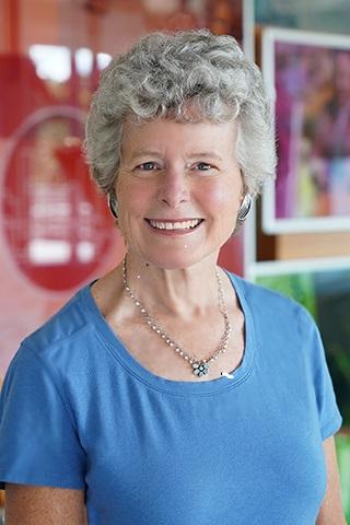 headshot of Jane Tuttle, PhD, ’79N, ’84N (MS), seen in blue top